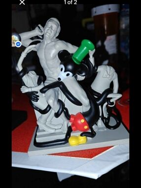 Black & White Cartoon Mouse Sculpture with Green Hat